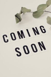 Eucalyptus branch with 'Coming Soon' message on white background for announcements.